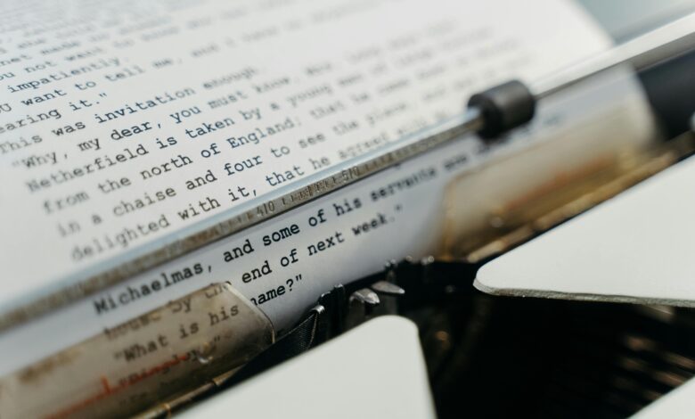 A vintage typewriter actively typing manuscript pages, evoking a sense of timeless creation.